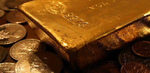 Gold slips to near one-week low