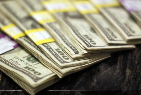 Dollar gives up gains after U.S. labor data
