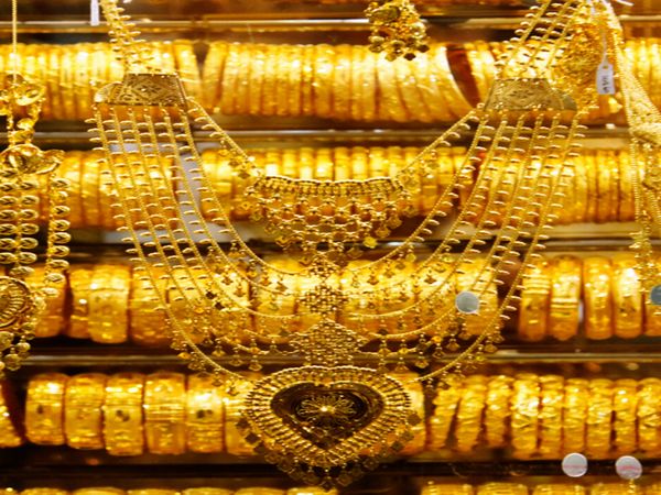 Gold prices settles after what benefited from the decline in the Chinese market